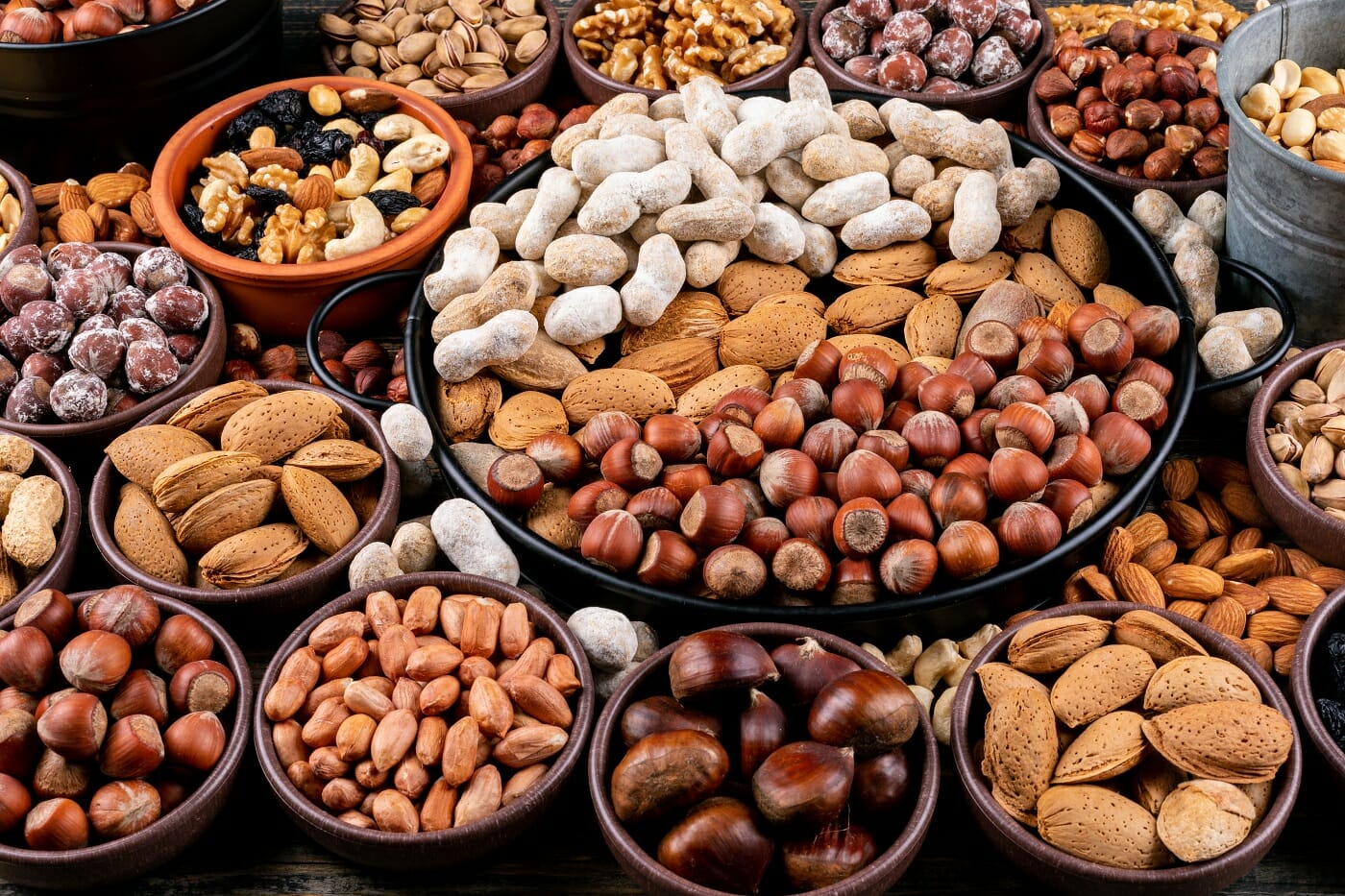 set-pecan-pistachios-almond-peanut-cashew-pine-nuts-assorted-nuts-dried-fruits-different-bowls-side-view
